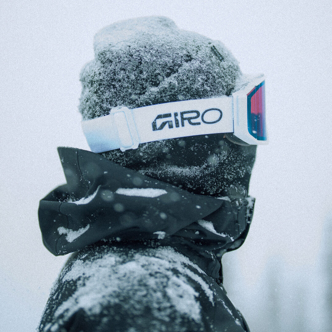 Boarder with white Revolt Pro goggles on and a beanie