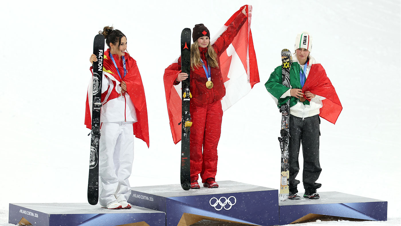 3 skiers on a podium