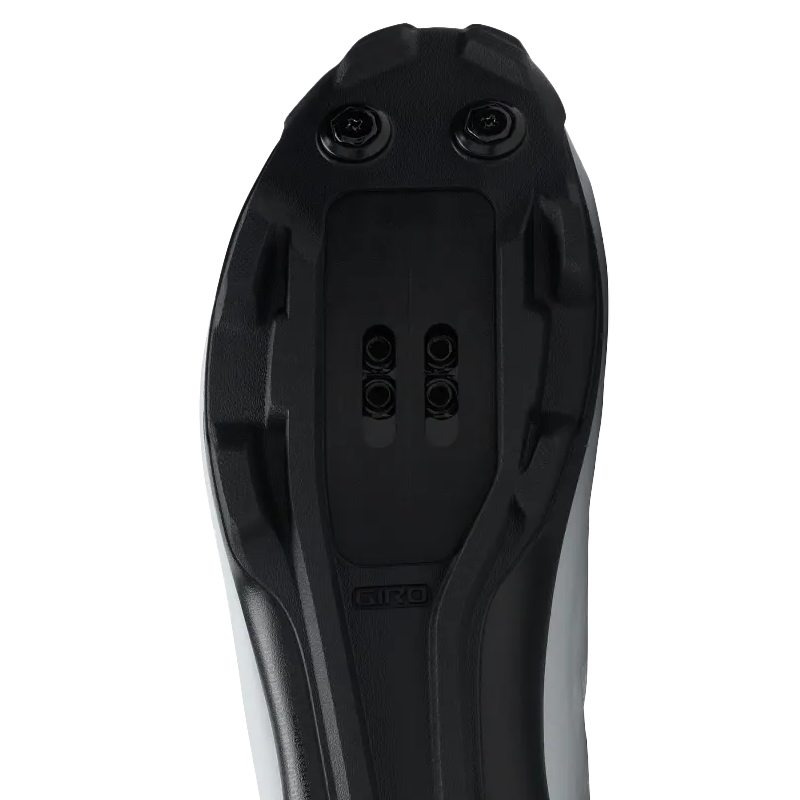 Mountain bike shoe sole with a 2-bolt clipless cleat system and lugged tread